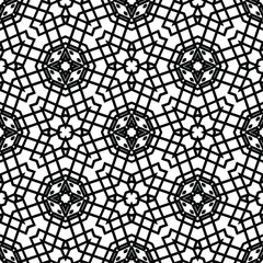 Geometric vector pattern with triangular elements. Seamless abstract ornament for wallpapers and backgrounds. Black and white colors.
