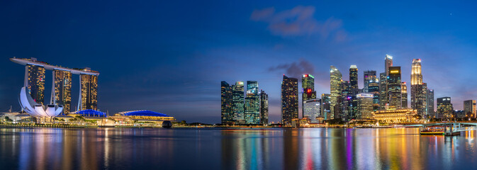Obraz na płótnie Canvas Ultra Wide angle image of Singapore Marina Bay cityscape at magic hour