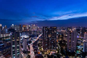 Wide panorama of Singapore cityscape at magic hour.