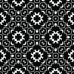  Geometric vector pattern with triangular elements. Seamless abstract ornament for wallpapers and backgrounds. Black and white colors.