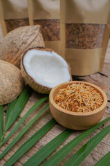 Dehydrated or toasted coconut and fresh coconut in the basket. 