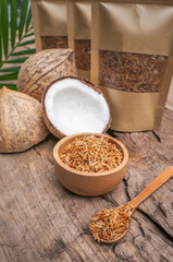 Dehydrated or toasted coconut and fresh coconut in the basket. 