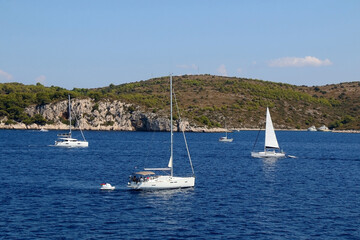 Fototapeta premium Sailing boat near island in Croatia. Beautiful Mediterranean landscape.