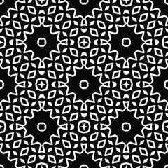 Geometric vector pattern with triangular elements. Seamless abstract ornament for wallpapers and backgrounds. Black and white colors.