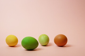 colorful easter eggs on a pink background