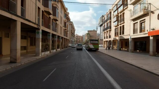 Driving through the Elche downtown, moving car street view. Spain. Famous touristic place concept