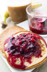 Gluten-free banana pancakes with chocolate and red berries