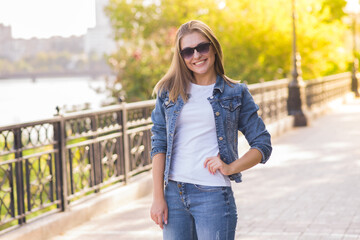 Portrait of a young happy and pretty blonde girl