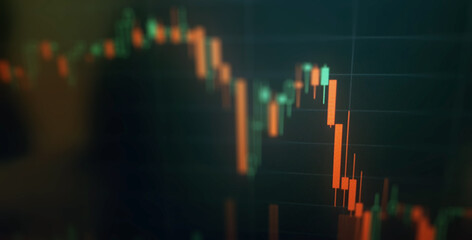 Closeup financial chart in stock market on monitor background. Chart graph as investment concept. Crisis background, red