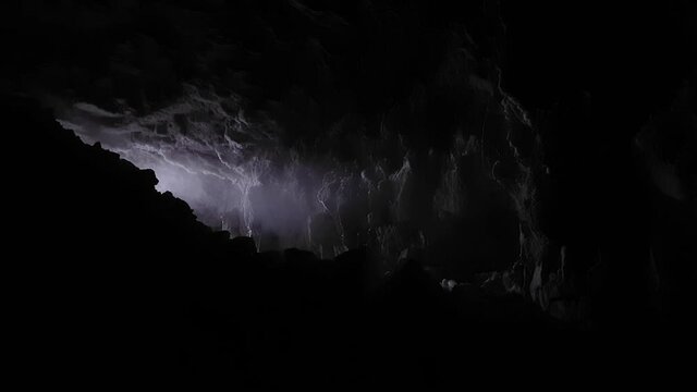 Blockage of stones at exit from cave. Stream of light and steam.