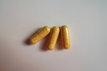 3 orange cellulose capsules of multivitamins from above