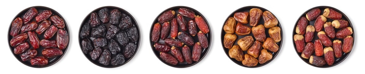 Mixed dates on a black plate, isolated on white, from above