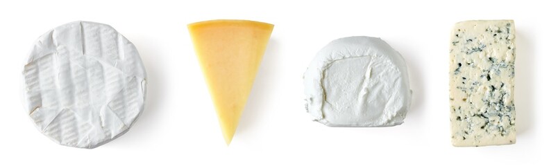 Various types of cheese isolated on white, from above