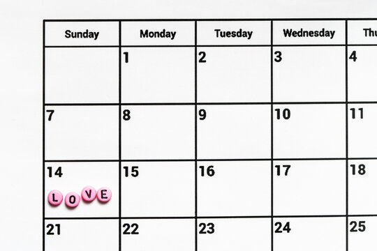 Valentines day monthly calendar with inscript LOVE on 14th February.