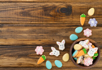 Easter cookies over wooden background with copy space