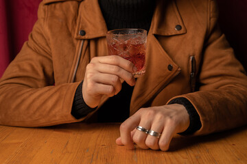 aperitif cocktail with decorations, boy with drink