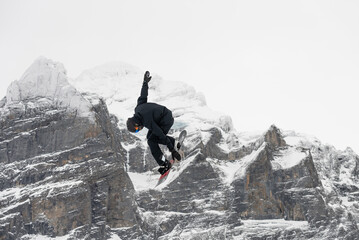 Snowboard ski freestyle big air contest in the background Mittelhorn mountain. Snowboard tricks,...