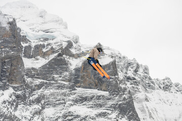 Snowboard ski freestyle big air contest in the background Mittelhorn mountain. Snowboard tricks,...
