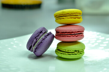 colorful macaroons on wooden background