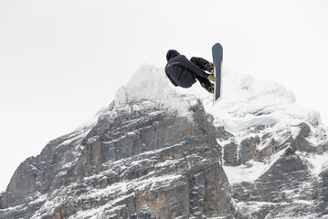 Snowboard ski freestyle big air contest in the background Mittelhorn mountain. Snowboard tricks,...