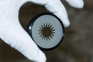 Special-Effects Filter, Photographic filter for Analog photography held by a white gloved hand,...