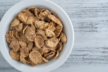 Whole grain glazed flakes in plate. Healthy breakfast, whole grain muesli in a bowl