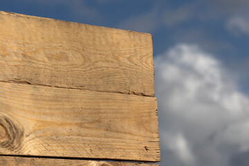 wooden sign in front abstract blue sky