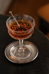 aperitif cocktail with decorations, boy with drink