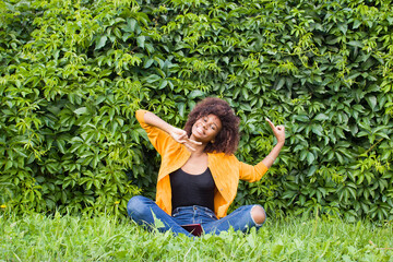 the Happy and young African American woman on the street having fun