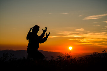 Woman praying in the morning.