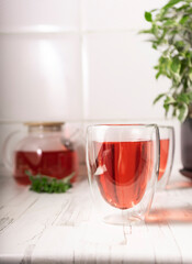 hibiscus tea,rose tea ceremony. Cup of freshly brewed fruit tea, light moody. the bright interior