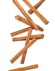 Aromatic cinnamon sticks falling on white background