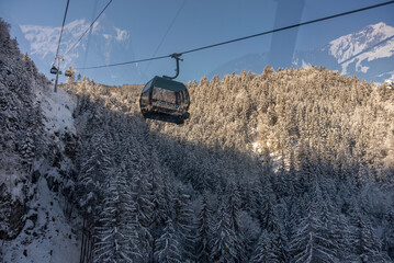 Gondola goes from the terminal in Grindelwald to Mannlichen. Ski lift in Switzerland Jungfrauregion.