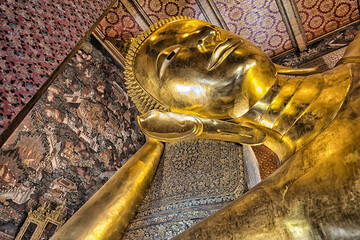 golden buddha statue at Wat Pho temple Bangkok