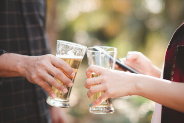 Happy group of friends drinking and drinking beer at the beer bar Christmas celebration.

