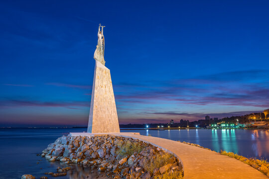 Statue of Staint Nicholas in Southern part of the UNESCO &ndash; protected ancient town of Nessebar at sunset. The statue is also known as the Fisherman. Tourism concept.