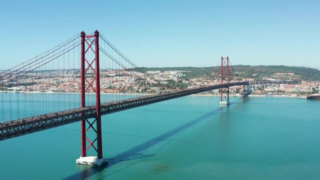 Flight over amazing 25 de Abril Bridge in Lisbon, Portugal
