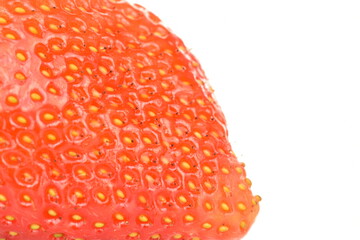 One bright red, ripe strawberry on a white background.