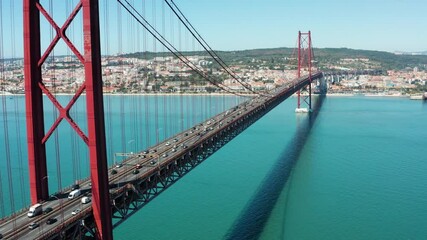 Flight over amazing 25 de Abril Bridge in Lisbon, Portugal