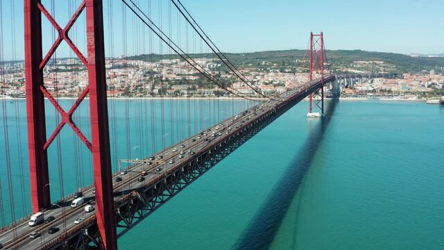 Flight over amazing 25 de Abril Bridge in Lisbon, Portugal