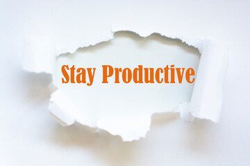 Stay Productive Motivation quote written behind a torn paper