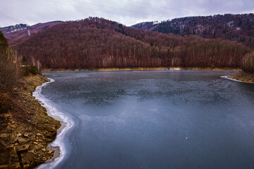 landscape with a lake in the mountains in winter