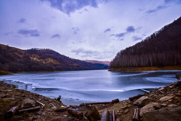 landscape with a lake in the mountains in winter