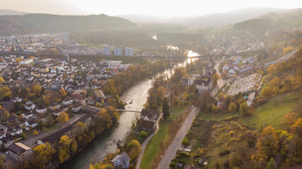 Drone view of city Brugg south-west and Umiken with Aare river, residential districts, bridge and...