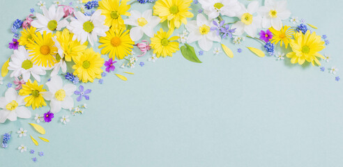 Naklejka na ściany i meble beautiful flowers on blue paper background