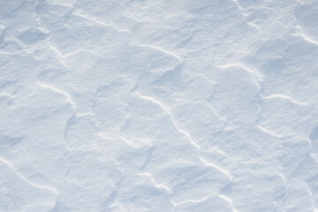 Fresh clean white snow background texture. Winter background with snowflakes and snow mounds. Snow lumps. Seasonal landscape details.