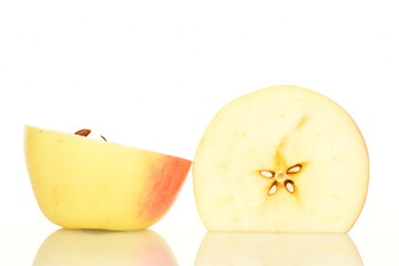 two halves of ripe organic, juicy, aromatic apples, close-up, on a white background.
