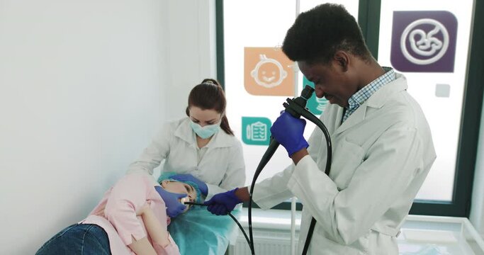 Laparoscopic Surgery. Surgeon Performing Endoscopy Surgery. Endoscopic Examination Of The Pharynx And Larynx. Otolaryngologist's Tool. Apparatus For Endoscopy And Manipulations In Otolaryngology
