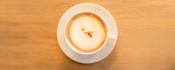 High angle view of cappuccino on table.