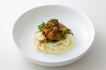 Korean food, Komak Bibimmyeon which is mixed with noodle, vegetables and blood cockle